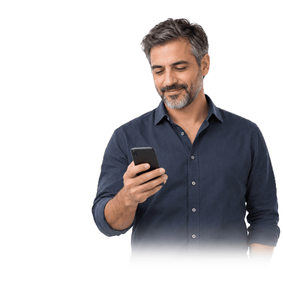 A man in a beige sweater looking at his phone