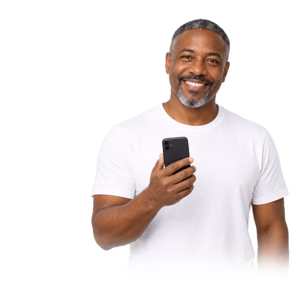 A man in a white t-shirt smiling, holding his phone