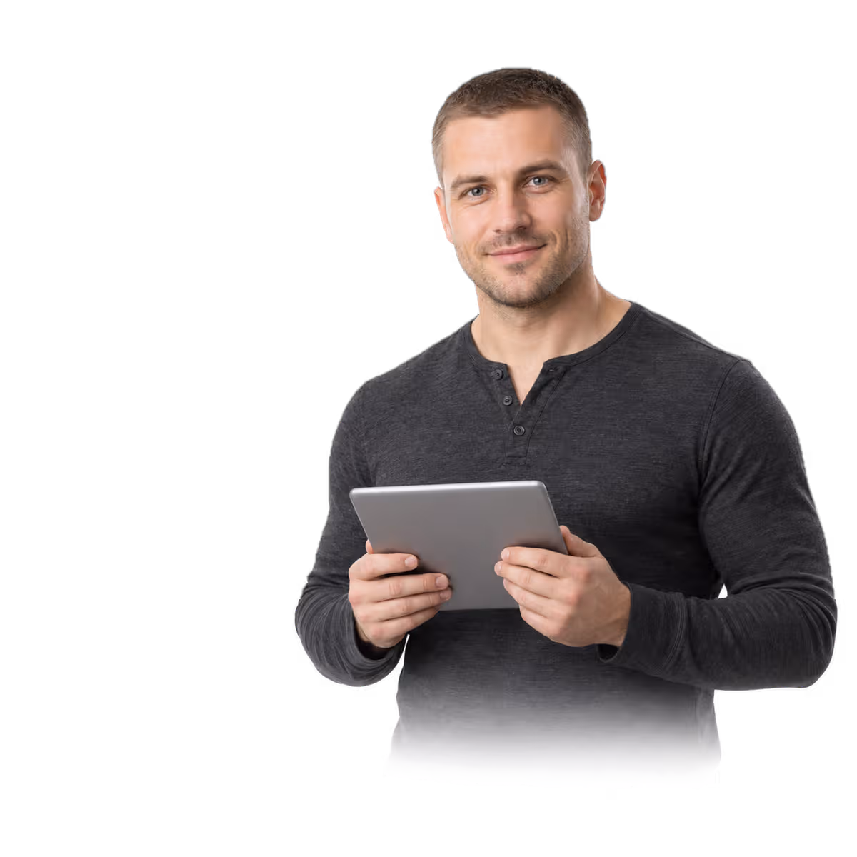 A man in a dark henley holding a tablet