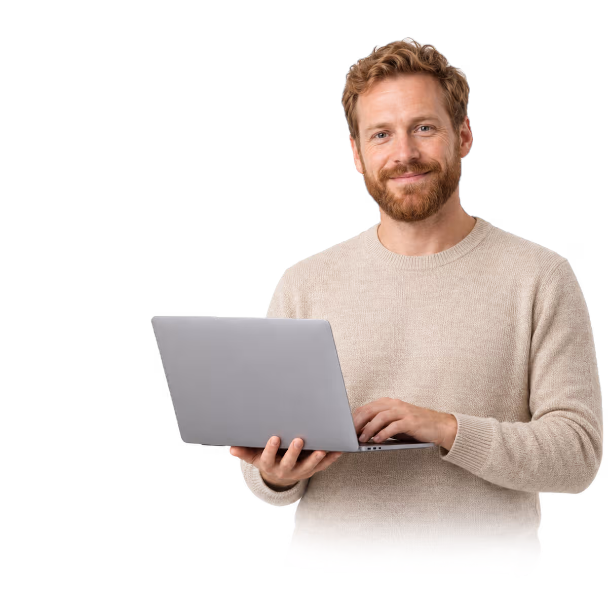 A man in a beige sweater holding a laptop